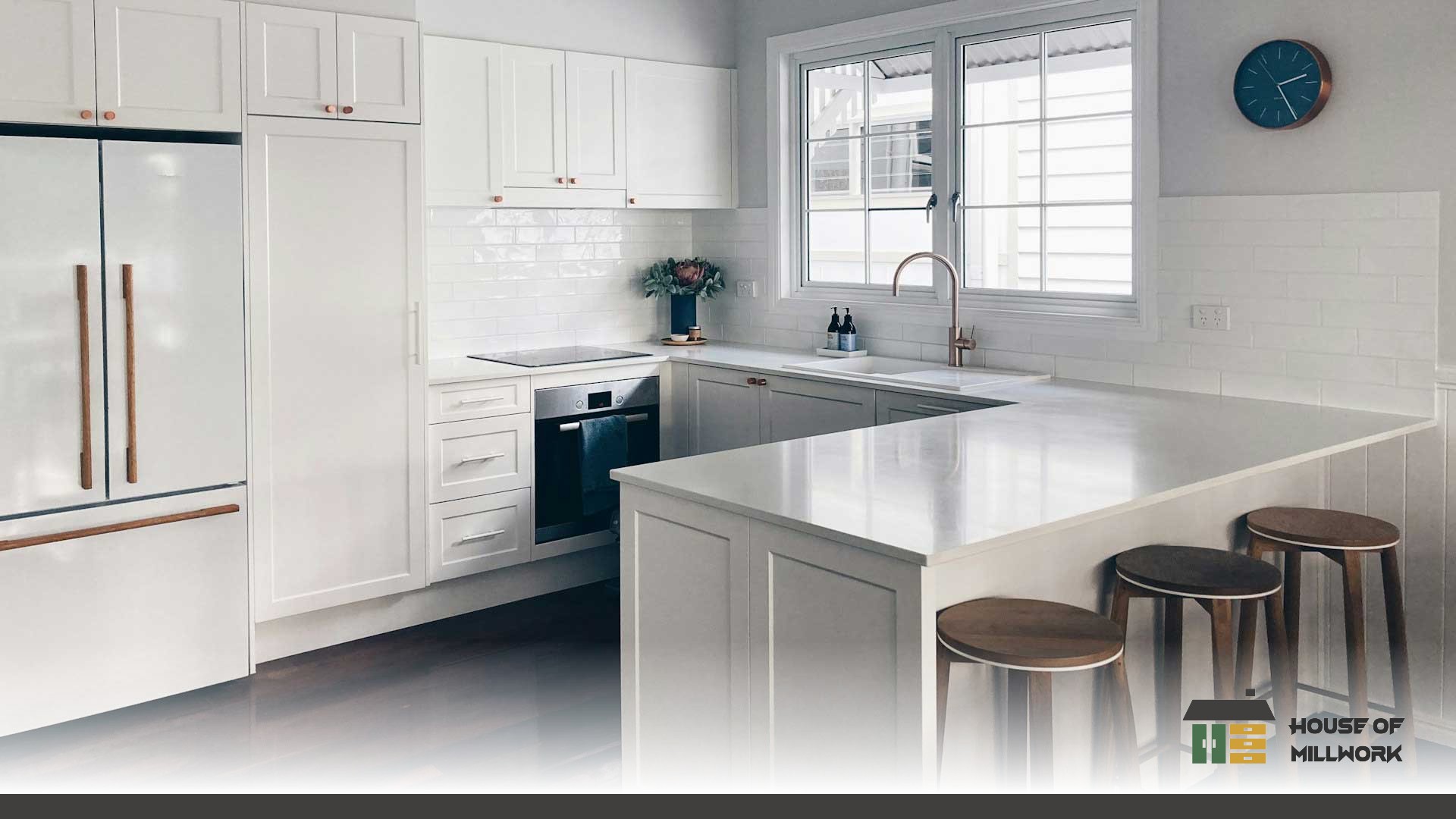 Durable 5/8 inch plywood cabinet boxes with soft-close hinges incorporated in kitchen islands that maximize seating and storage.