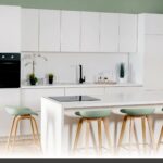 DEMXX Kitchen Cabinets with custom matte white shaker doors illustrating salvaged finds versus new builds.