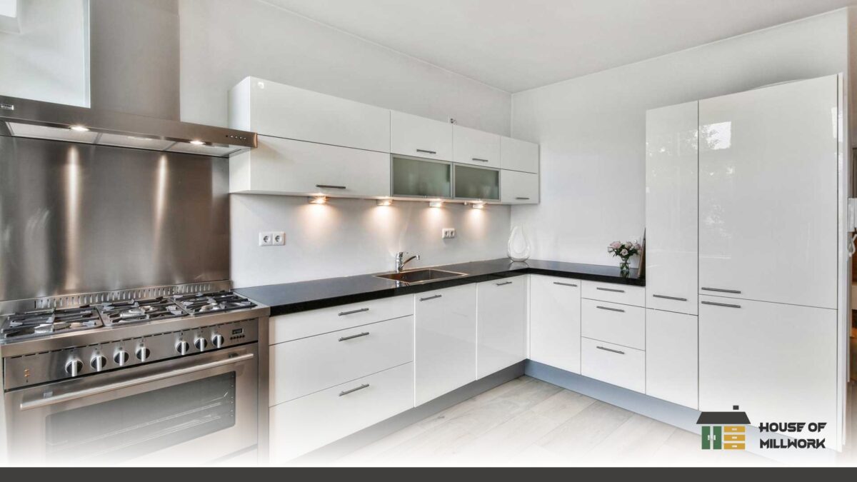 Custom shaker-door kitchen cabinets in matte white with handles, highlighting kitchen cabinet installation in Nanaimo.