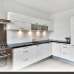 Custom shaker-door kitchen cabinets in matte white with handles, highlighting kitchen cabinet installation in Nanaimo.