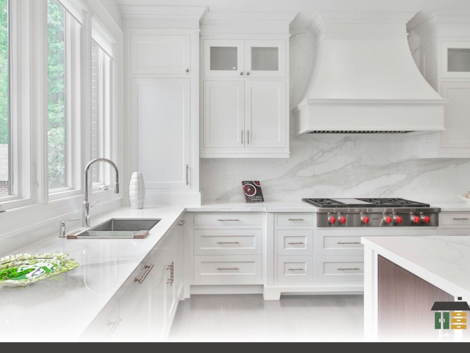 Custom shaker-door kitchen cabinets in matte white with handles featured in local cabinet maker vs big box Nanaimo buyers guide.