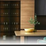Premade cabinets explained with a modern custom shaker-door kitchen in matte white and handles.