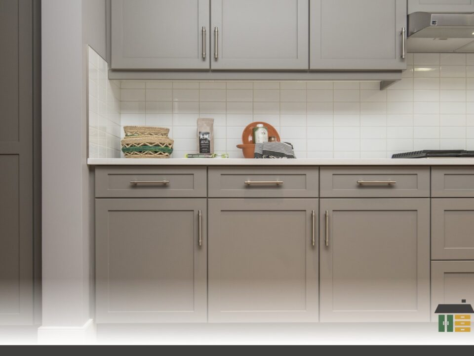Explore value kitchen cabinets with custom shaker-door style in matte white with handles.