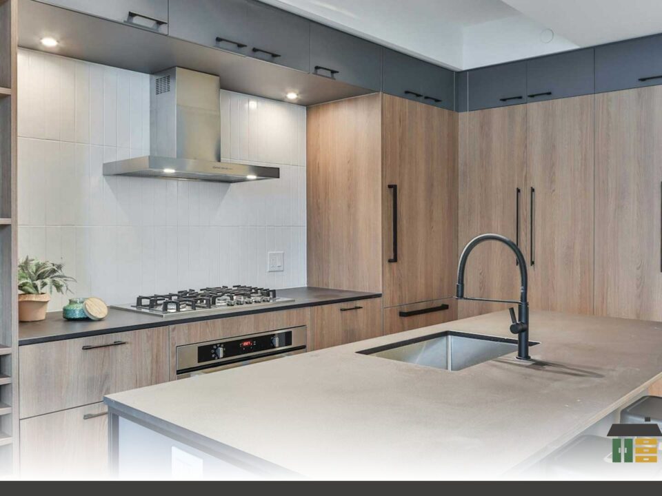 Custom shaker-door kitchen cabinets in matte white with handles, ideal for small Nanaimo condos space-saving ideas.