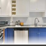 Custom shaker-door kitchen in matte white with handles featuring kitchen storage that works with pull-outs and corner solutions.