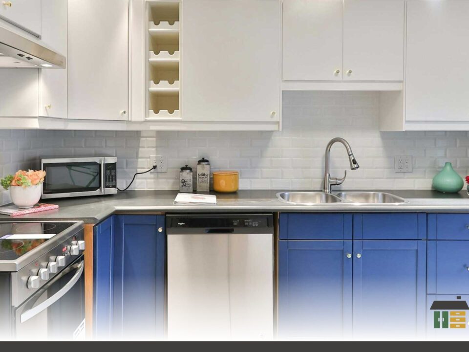 Custom shaker-door kitchen in matte white with handles featuring kitchen storage that works with pull-outs and corner solutions.