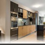 Planning your cabinet order in Nanaimo featuring custom shaker-door kitchens with matte white finishes and handles.