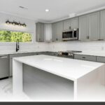 How House of Millwork designs your kitchen featuring a custom matte white shaker-door kitchen with handles.